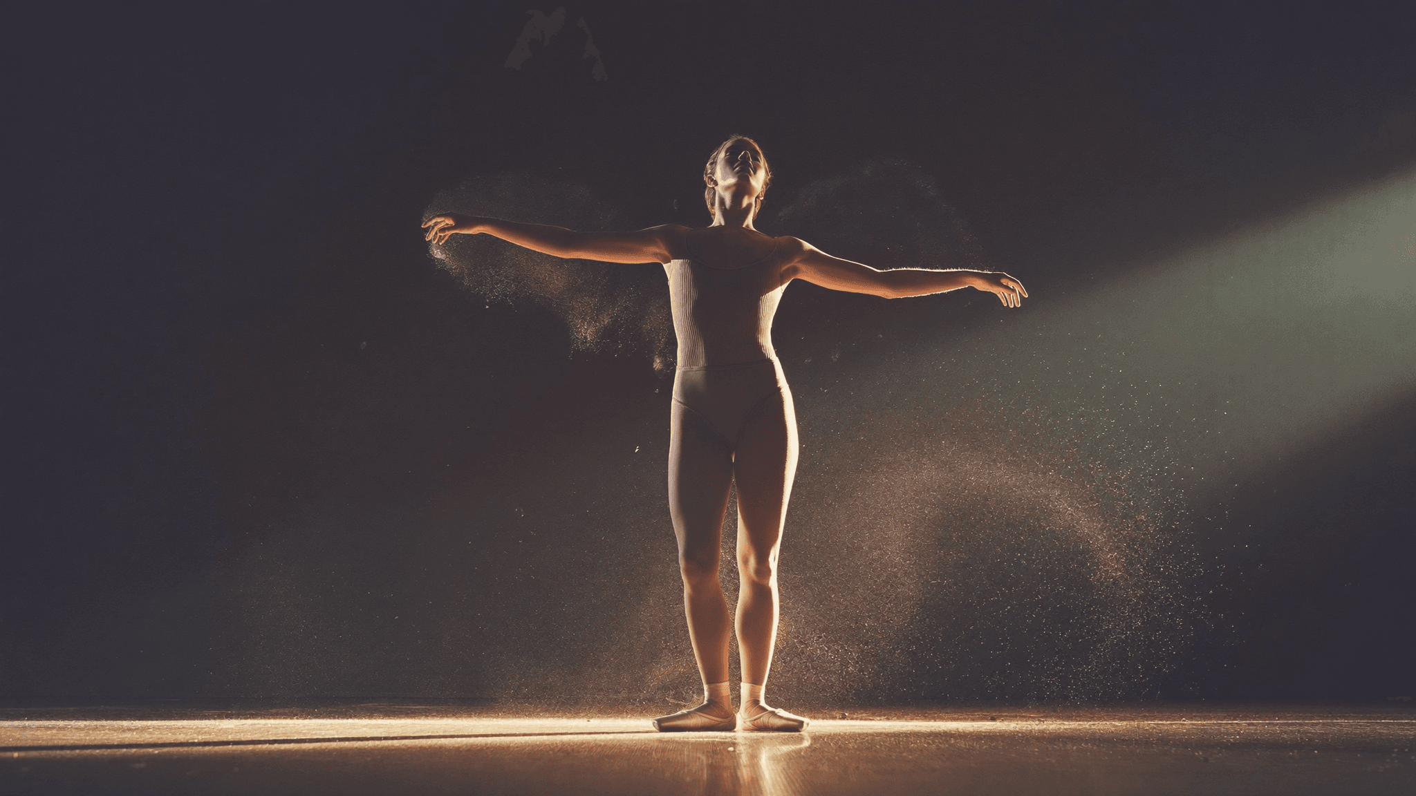 DanceSpace competition dancer on a grand stage in warm light